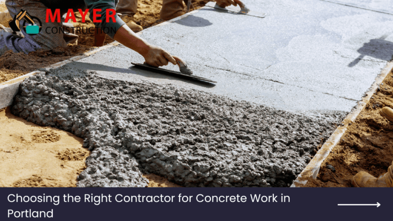 Construction worker smoothing freshly poured concrete for a project in Portland, featuring Mayer Construction logo and title "Choosing the Right Contractor for Concrete Work in Portland."