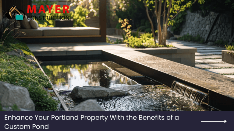 Custom pond with natural stone features and surrounding greenery, enhancing a Portland property landscape, promoting Mayer Construction's pond construction services.