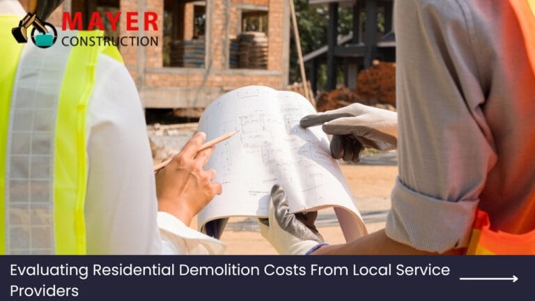 Construction professionals reviewing plans for residential demolition costs, featuring Mayer Construction branding and a construction site background.