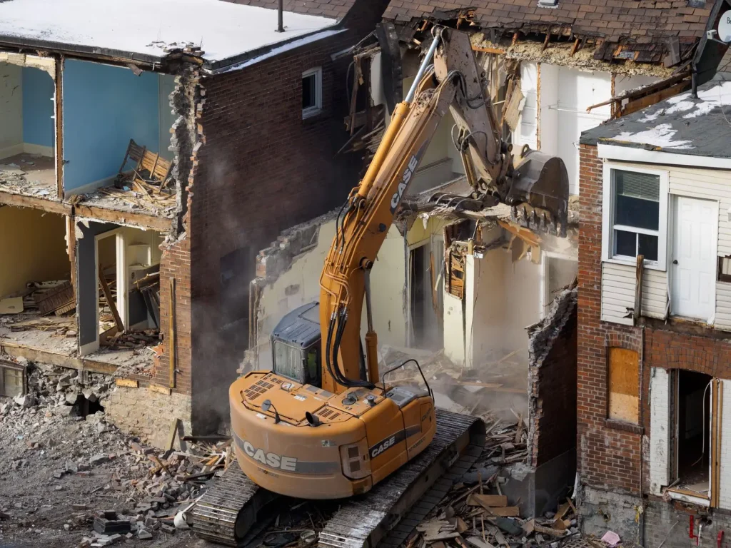 Excavator demolishing an old building for a demolition contractor project in Walnut Grove, Vancouver, WA